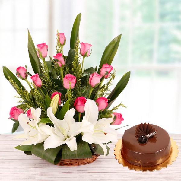 Floral Basket Arrangement of 15 Pink Roses and 2 White Asiatic Lilies with Half Kg Chocolate Cake