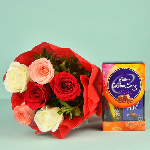 6 Assorted Roses in a paper packing with Celebration Pack ( 65 gm)