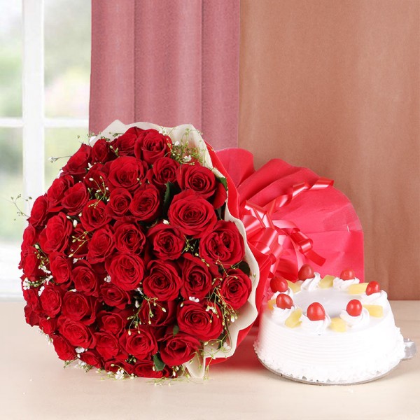 50 Red Roses with Pineapple Cake (Half Kg) and Red and White Paper