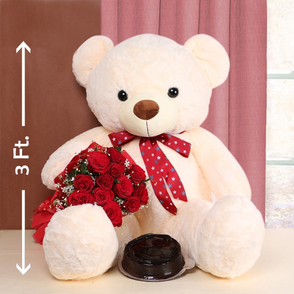 12 Red Roses in Red Paper with Half Kg Truffle Cake and Teddy Bear 3ft.