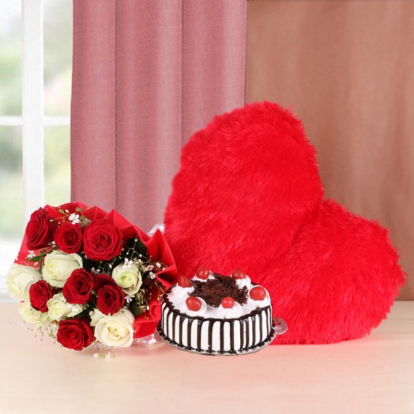 12 Red and White Roses with Red Heart-shaped fur Cushion (12 inches) and Black Forest Cake (Half Kg) - Red Paper