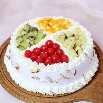 Half Kg Pineapple Fruit Cake Topped with Fresh Fruits and White Chocolates