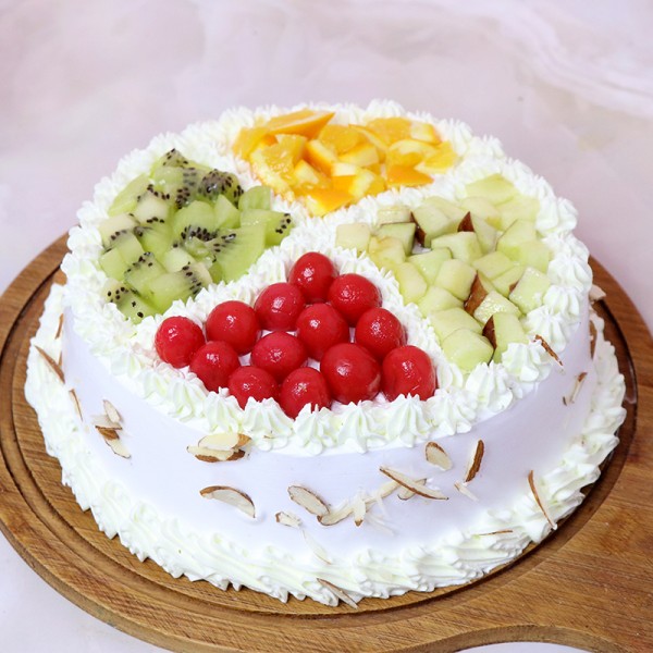 Half Kg Pineapple Fruit Cake Topped with Fresh Fruits and White Chocolates
