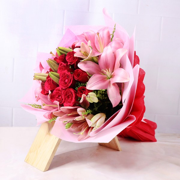 20 Red Roses and 4 Asiatic Pink Lilies in Paper Packing