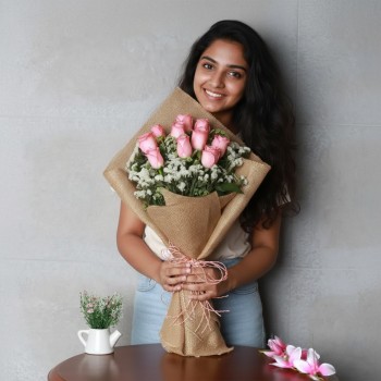 10 Pink Roses in Jute Packing and Pink Rafia