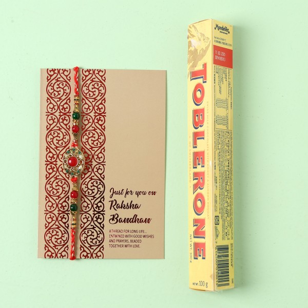 Vibrant Designer Rakhi And Toblerone Combo
