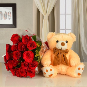 20 red roses in cellophane packaging with 12 inches teddy