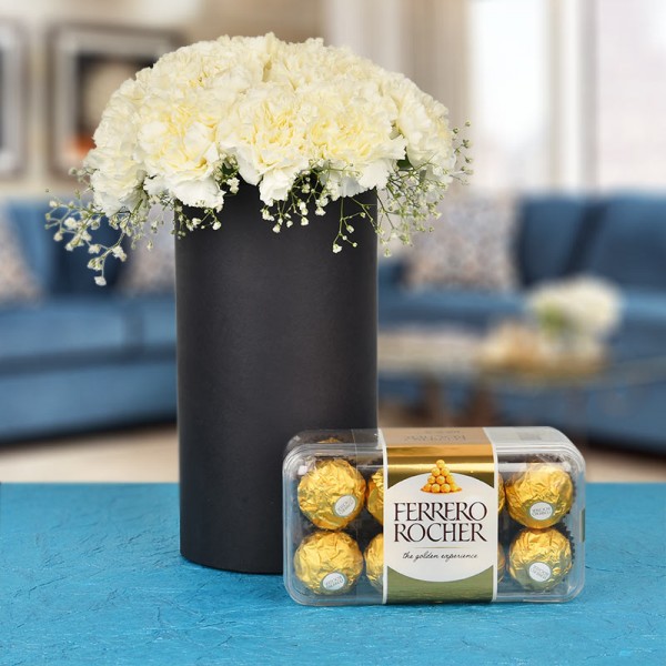 20 White Carnations In A Black Cylindrical Vase with 16 pcs Ferrero Rocher