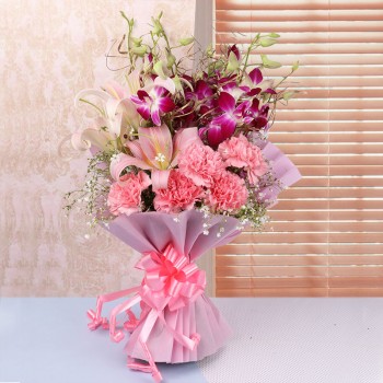 4 Purple Orchids and 4 Pink Asiatic Lilies and 5 Dark Pink Carnations in Pink paper
