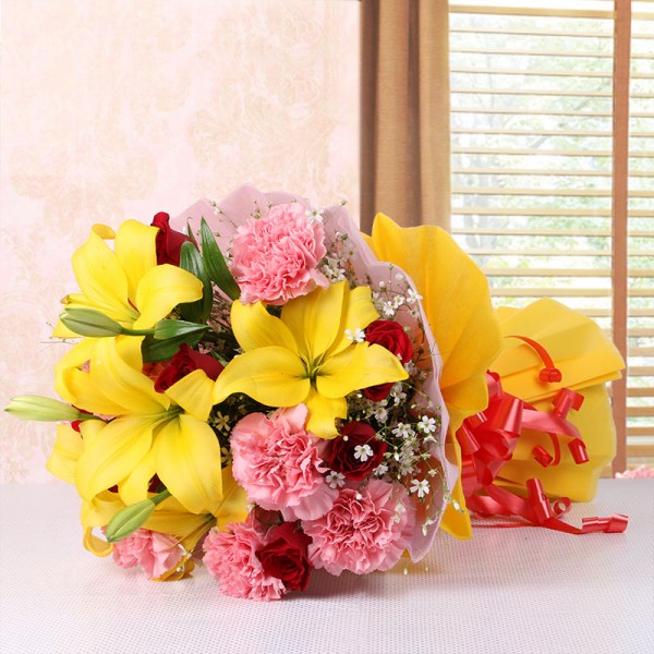 5 Asiatic Yellow Lilies and 8 Red Roses and 8 Pink Carnations with Pink and Yellow Paper