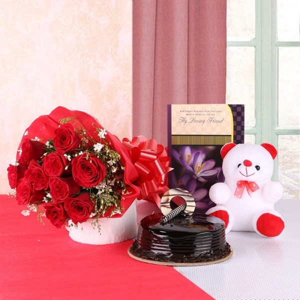 10 Red Roses in Red Paper with 1 Teddy Bear (6 inches), 1 Greeting Card and Chocolate Truffle (Half Kg)