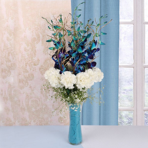 5 Blue Orchids with 12 White Carnations in a Glass Vase and Blue Paper