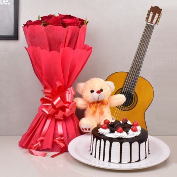 12 red roses with Half kg black forest cake and 1 Teddy bear (6 inches) along with Live song by guitarist