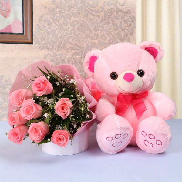 8 Pink Roses in Pink paper packing with 1 Pink Teddy Bear (10 inches)