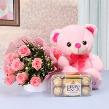 8 Pink Roses in Pink paper packing with 1 Pink Teddy Bear (10 inches) and Ferrero Rocher Chocolates (16 pcs)