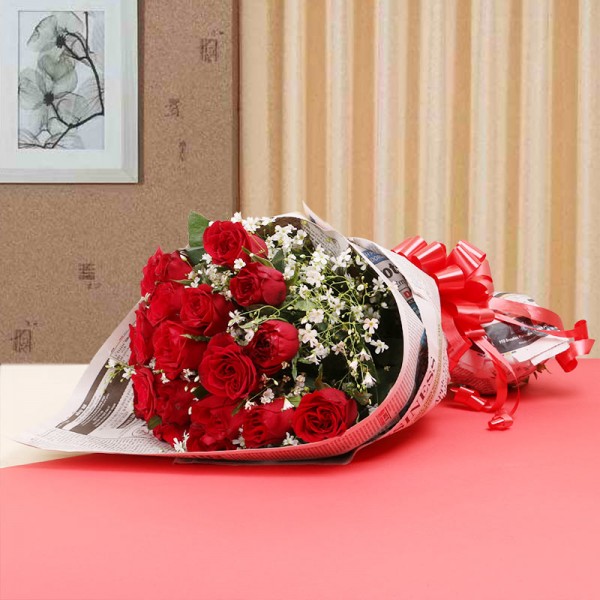 15 Red Roses in Newspaper paper packing