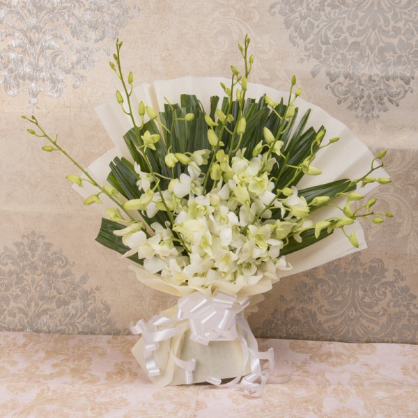 6 White Orchids in White paper packing
