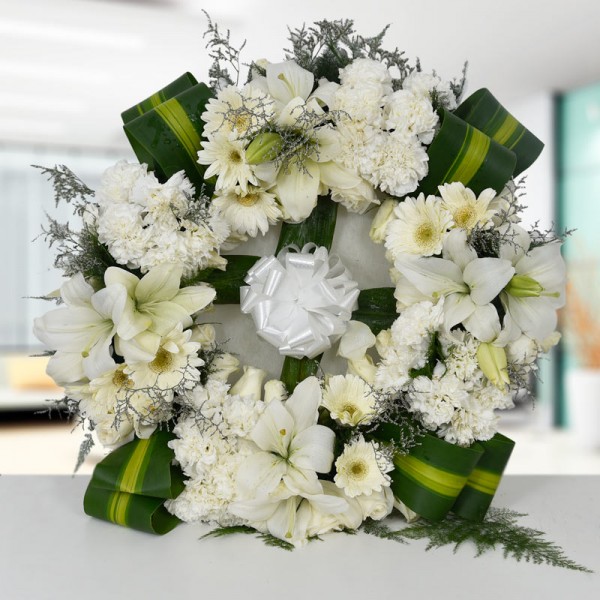 1 Fresh Wreath of 4 Oriental White Lily and 30 White Carnation and 10 White Gerbera and 15 White Roses
