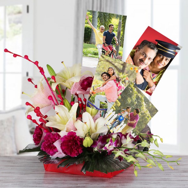 4 White Asiatic Lilies with 10 Dark Pink Carnations and 2 Blue orchids in Net and Paper packing and 4 Personalised Photos