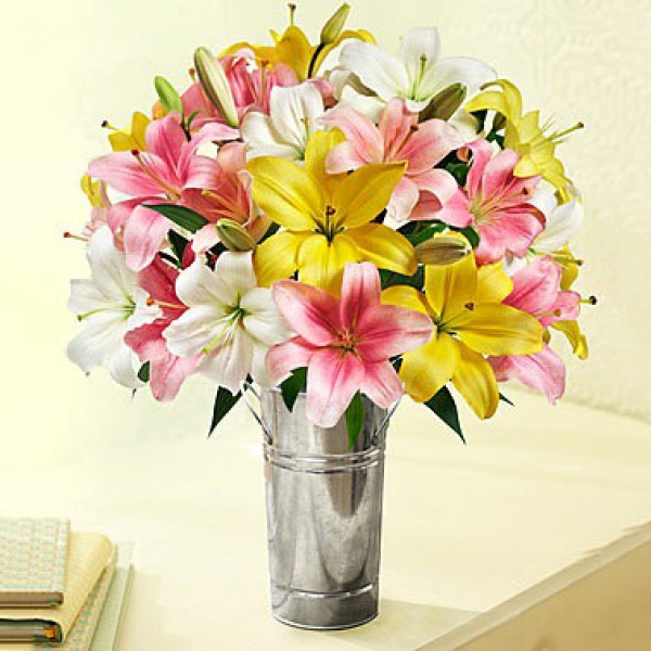  7 Assorted Asiatic Lilies in a Glass Vase