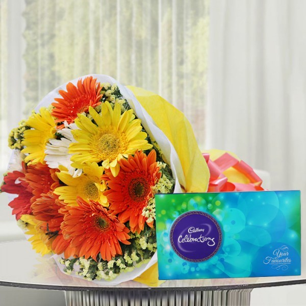 10 Colorful Gerberas in Yellow and White paper packing, Orange Bow with Cadbury Celebration(131.3gm)
