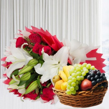 A bunch of Flowers (12 Red Roses, 3 White Asiatic Lily) in Red and White Paper Packing, White Paper Bow with 2 Kg Seasonal Fruits in Basket