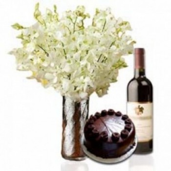 8 White Orchid in a Glass Vase with Half Kg Dark Chocolate Cake and Bottle Of Red Wine