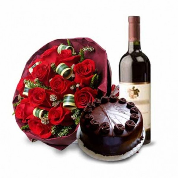 12 Red roses in Paper Packing with Bottle of Red Wine and Half Kg Chocolate Cake