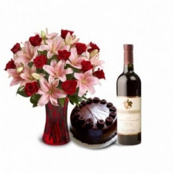 5 Pink Asiatic Lilies and 10 Red Roses with Half Kg Dark Chocolate Cake, Bottle Of Red Wine in a Glass Vase