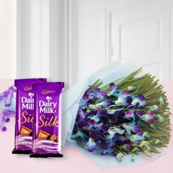 6 Blue Orchids - Blue Paper packing - Purple Bow - 2 Cadbury's DairyMilk Silk (60 gms each)