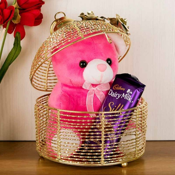 6 Inches Teddy and 1 Cadbury Dairy Milk Silk Chocolate (60 Gms) in a Cage