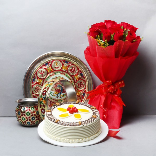 10 Red Roses in Red Paper Packing with Half Kg Butterscotch Cake and One Designer Pooja Thali Set