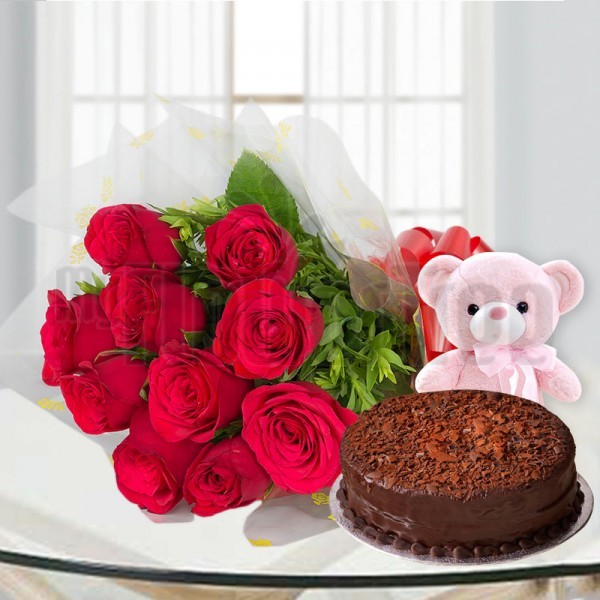 10 Red Roses in Cellophane Packing, Red Bow with Half Kg Chocolate Cake and 1 Teddy Bear (6 inches)