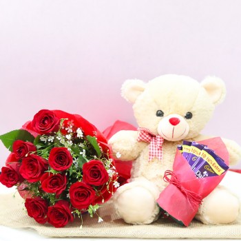 10 Red Roses wrapped in Paper Packing with Teddy Bear (12 inches) and 5 Dairy Milk Chocolate (13.2 gm)