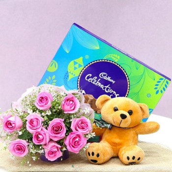 10 Pink Roses wrapped in Paper Packing with Brown Teddy Bear (6 inches) and One Cadbury Celebration (141.4 gm)