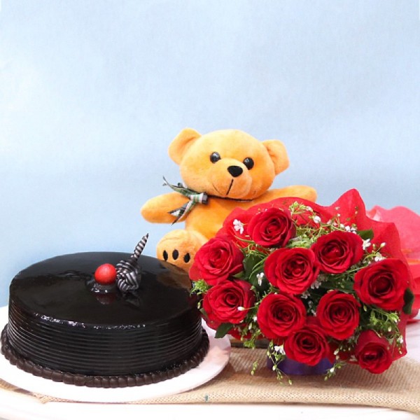 10 Red Roses wrapped in paper packing with Half Kg Chocolate Cream Cake and Teddy Bear (6 inches)