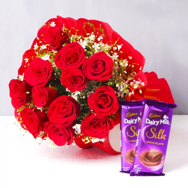 12 Red Roses in Paper Packing with 2 Cadbury's DairyMilk Silk (60 gms each)