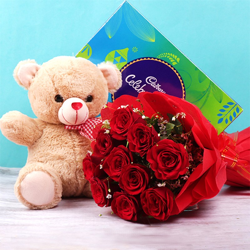 10 red roses in Paper Packing with One Cadbury Celebration Pack (141.4 gm) and 12 inches Teddy Bear