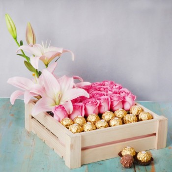 24 Pink Roses,2 Pink Asiatic Lilies, 12 pcs Ferrero Rocher Chocolate Arrangement in a Basket