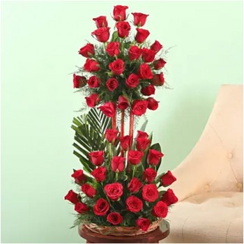 3 tiered floral arrangement of 50 Red Roses in a Basket