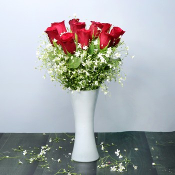 Moon shape floral arrangement of 15 Red Roses in a Vase