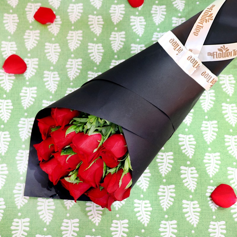 12 Red Roses in Paper Packing
