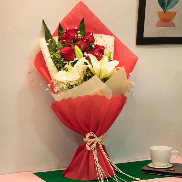 2 White Oriental Lilies and 10 Red Roses with Paper Packing