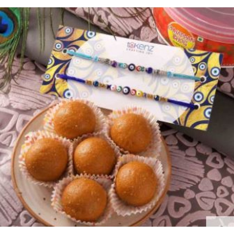 Rakhi Set Of 2 Evil Eye Rakhi With Besan Ladoo