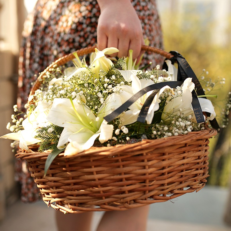 Floral Arrangement of 3 Yellow Asiatic Lilies, 4 Red Glads, 4 Red Carnations and 2 White Orchids in a Basket