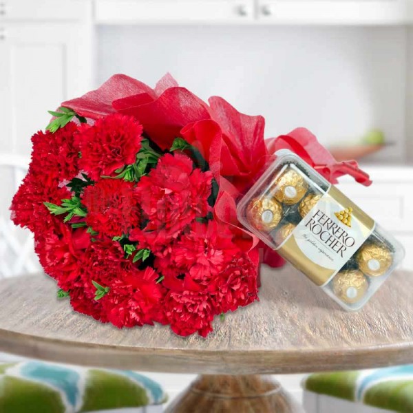 12 Red Carnations wrapped in crape paper with 16 Pcs Ferrero Rocher