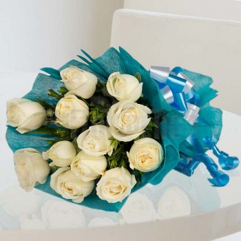 12 White Roses wrapped in blue special paper