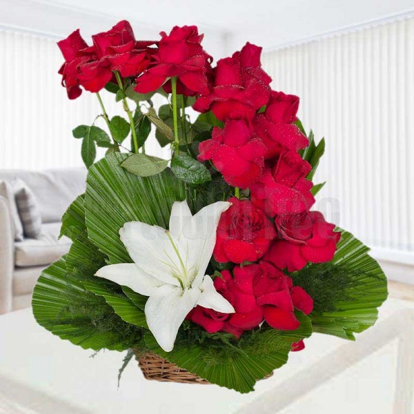  1 Asiatic White Lilies and 15 Red Roses arranged in a Basket