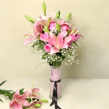 6 Pink Oriental Lilies wrapped in Cellophane paper