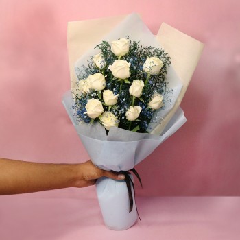 12 White Roses wrapped in blue special paper